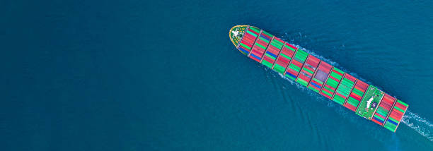 istock Container ship carrying container for import and export, business logistic and transportation by ship in open sea, Aerial view container ship with copy space. 1162893660