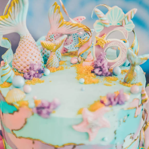 istock A beautiful  cake decorated with mermaid tails. 1162894953