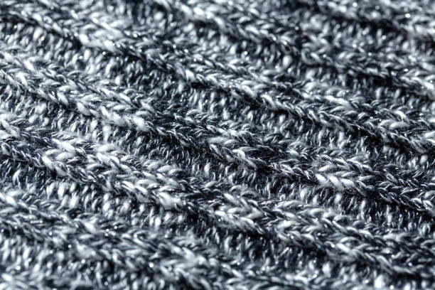 istock Black and white threads wool texture made of cotton or wool. closeup. 1162895069