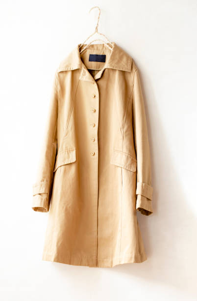 istock Beige elegant trench coat isolated over white 1162895696
