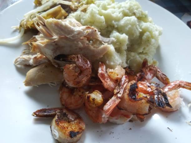 istock BBQ prawns with veggies and mashpotato 1162897009