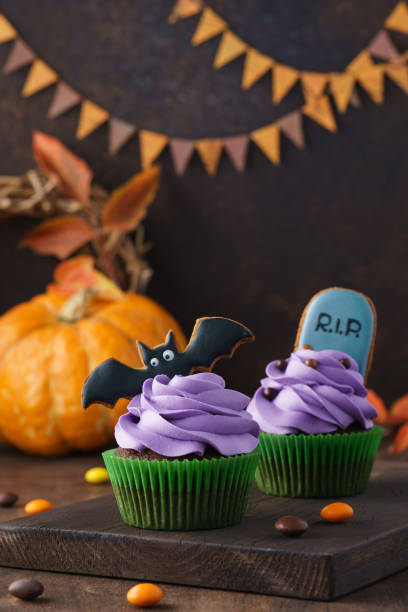 istock Bat and tombstone gingerbread cookies as cupcake decorations. 1162899629