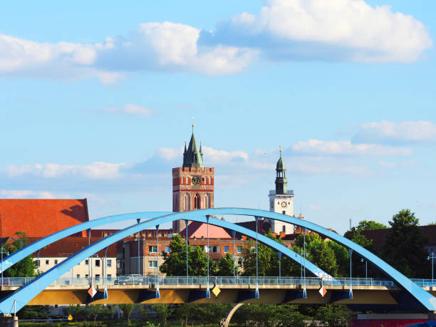 Frankfurt (Oder), Germany - June, 2019: Bridge to Frankfurt or Oder. Gothic church tower in Frankfurt on the Oder, city Council, Saint Marienkirche
