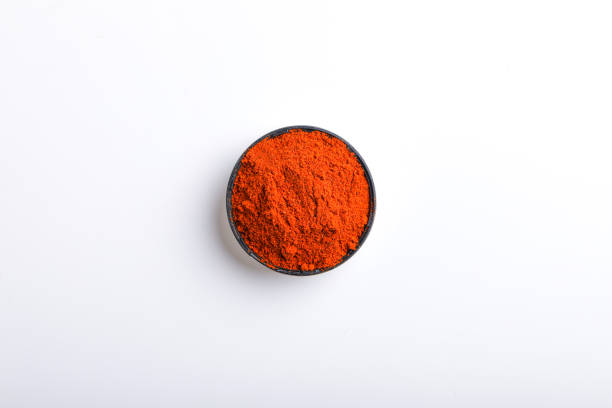 Indian spice Red chilli powder in bowl on white background