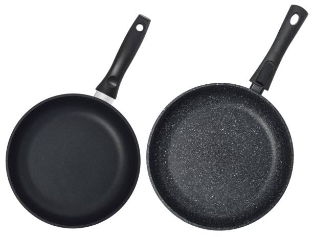 istock Empty black frying pan isolated on white background. Set of two pans. 1162903052
