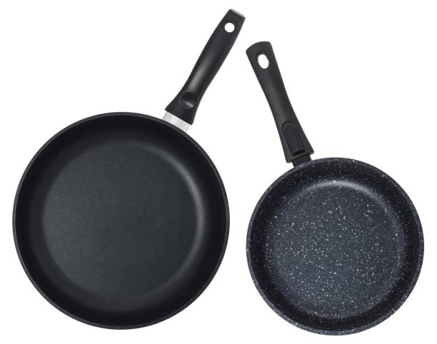 istock Empty black frying pan isolated on white background. Set of two pans. 1162903069