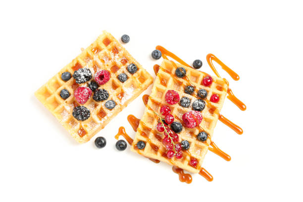 istock Waffles under caramel topping isolated on white background 1162904694