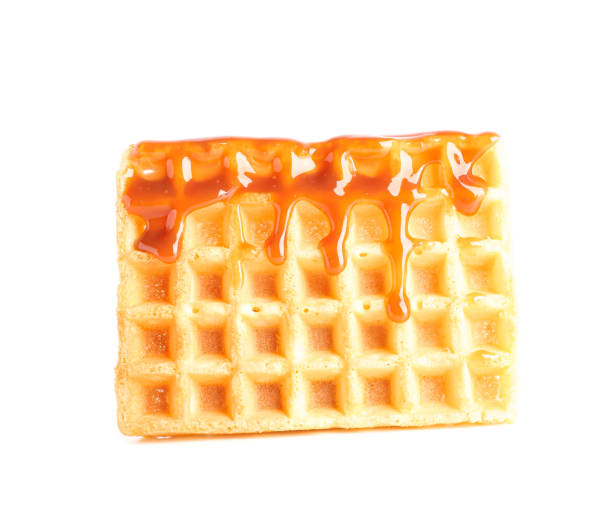 istock Waffle under caramel topping isolated on white background 1162904715