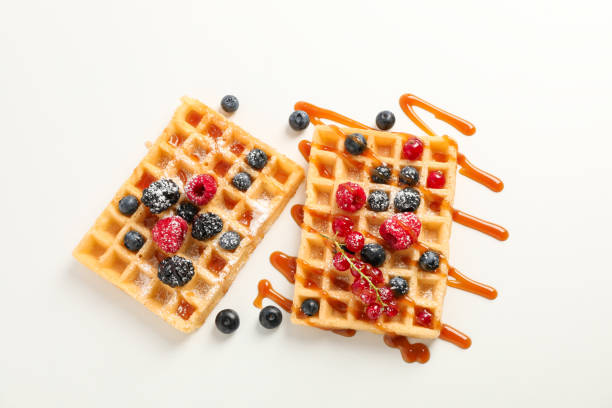 istock Waffles under caramel topping on white background 1162905339
