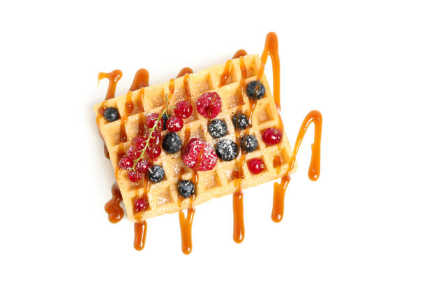 istock Waffle under caramel topping isolated on white background 1162905350