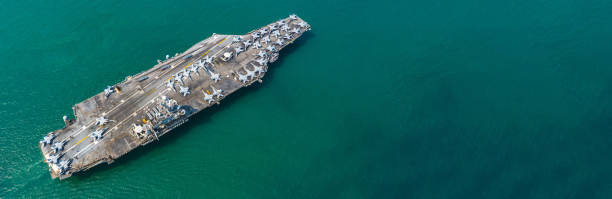 istock Aerial view Navy Nuclear Aircraft carrier, Military navy ship carrier full loading fighter jet aircraft with copy space. 1162906574