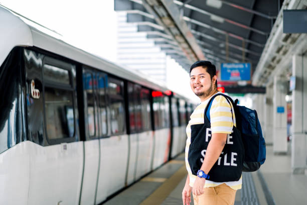 istock Young Asian Man at Train Station in Kuala Lumpur 1162907755