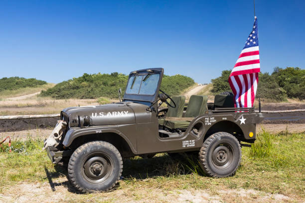 Old WWII US Army Jeep with US flag  on an old, unused military training ground used by fans of old military vehicles, Darlowo, Poland