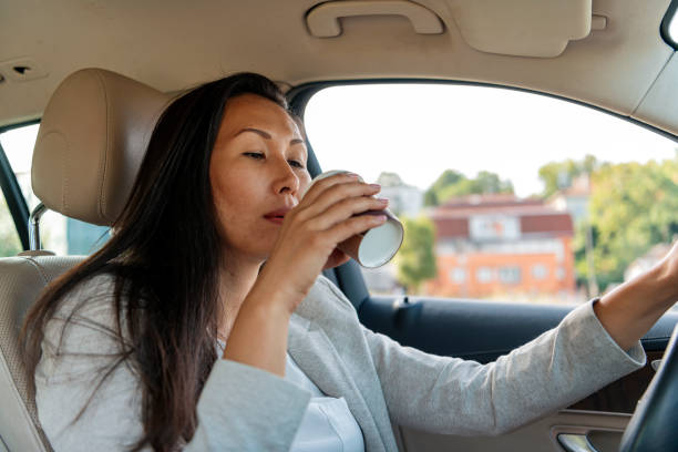 istock Businesswoman driving a car 1162910099