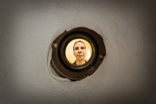 Woman seen through the peephole