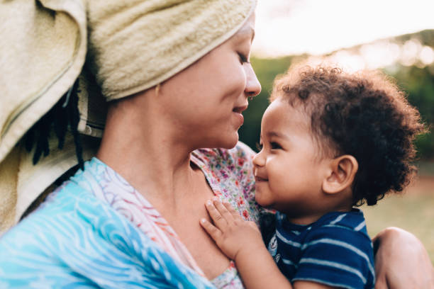 istock Affectionate young African descendant mother with her baby son 1162915640