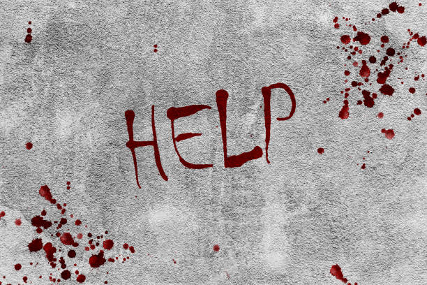 Help text is written in blood on a concrete wall for the background
