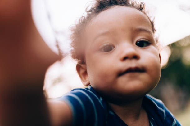 istock African descendant baby taking a selfie 1162915751