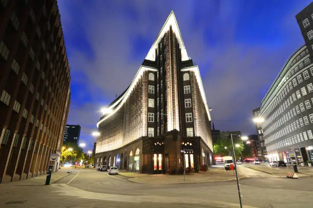Wide shot of Chilehaus (Chile House) building at night in Hamburg, Germany. It was designed by the German architect Fritz Höger and finished in 1924
