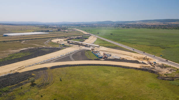 istock Aerial view on the new road construction site 1162924079