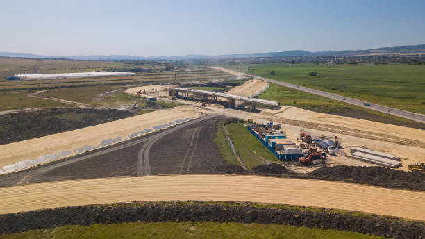 istock Aerial view on the new road construction site 1162924102