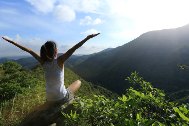 istock Yoga woman practice on mountain peak 1162925590