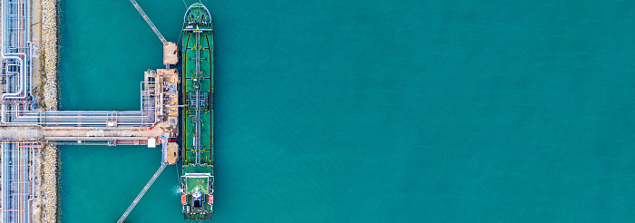 Aerial view tanker ship at the port, Import export business logistic and transportation by tanker ship with copy space.