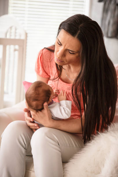 istock Affectionate mother bonding with her newborn baby daughter 1162929231