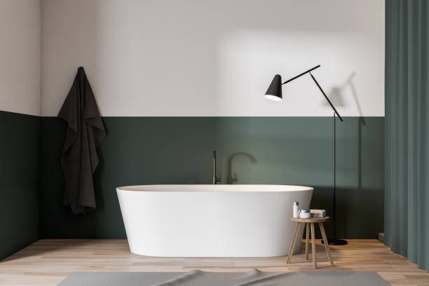 istock Green and white bathroom with tub 1162930667
