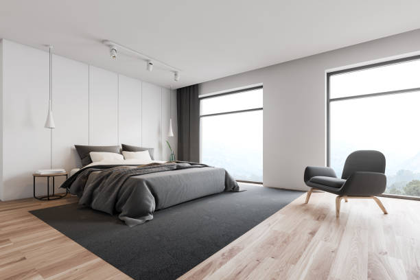 istock White loft master bedroom corner with armchair 1162930740