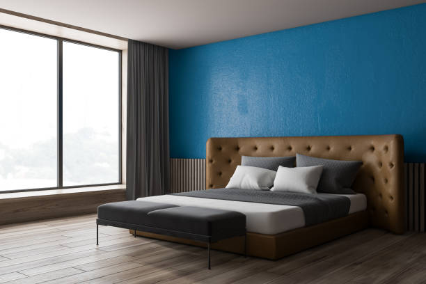 istock Blue and wooden bedroom corner 1162930747