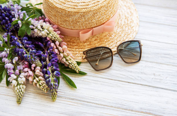 istock Straw hat and lupine flowers 1162931550