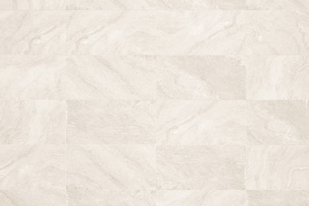 texture in granito crema e ceramica di piastrelle di sfondo o ardesia, texture senza cuciture beige chiaro chiaro. motivo del pavimento senza cuciture in piastrelle di marmo per design, decorazione parete di trama in cemento. - tile bathroom tiled floor marble foto e immagini stock