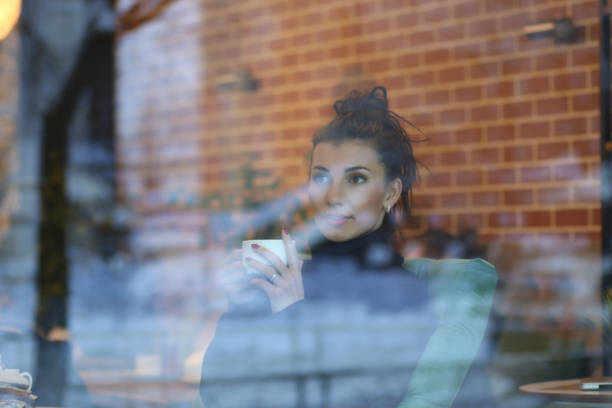 istock A young woman in a cafe 1162931642