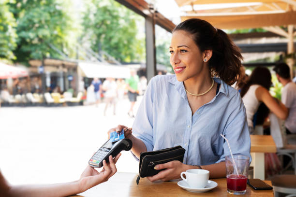 istock Woman making card payment. 1162932655