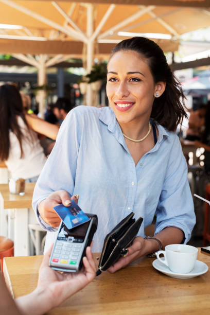 istock Woman making card payment. 1162932676