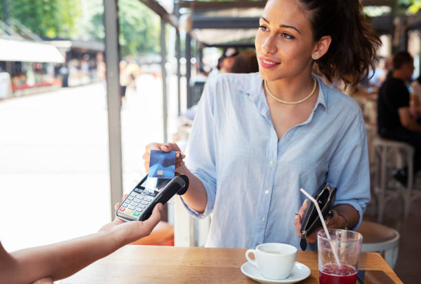 istock Woman making card payment. 1162932760