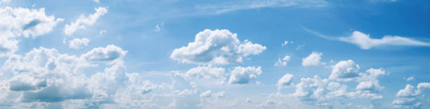 istock blue sky with white cloud and sunshine 1162932945
