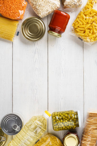 istock Various uncooked cereals, grains, pasta and canned food. 1162935656