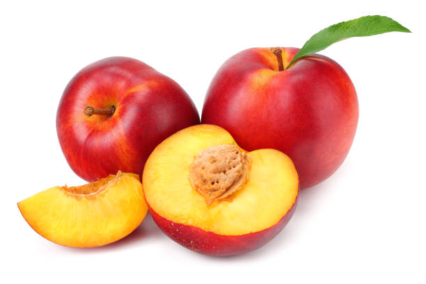 istock Nectarine with green leaf and slices isolated on white background 1162937881