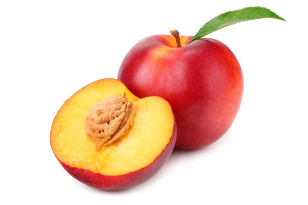 istock Nectarine with green leaf and slices isolated on white background 1162937892