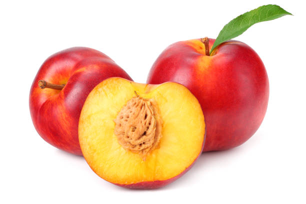 istock Nectarine with green leaf and slices isolated on white background 1162938227