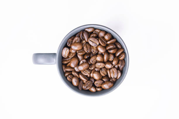 istock coffee beans in dark coffee cup on isolated white background 1162938273