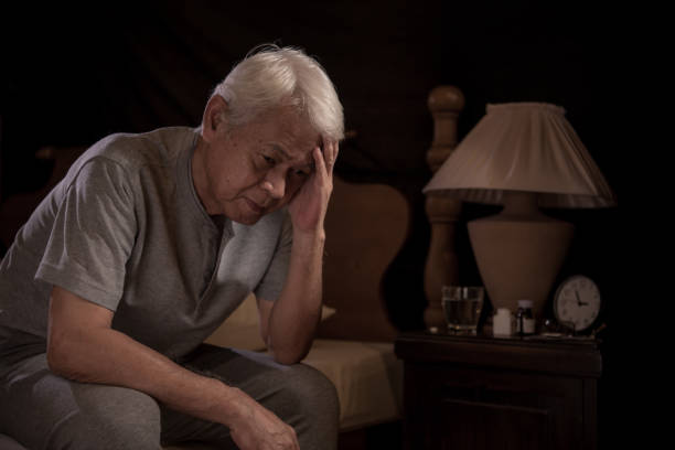 istock A depressed senior person sitting in bed cannot sleep from insomnia 1162939760