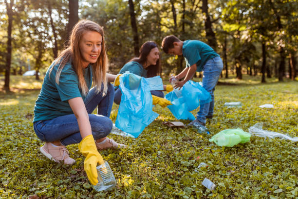istock Students cleaning the local park from trash 1162940193