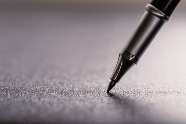 automatic plastic ballpoint pen with clipping path on black background. close up.