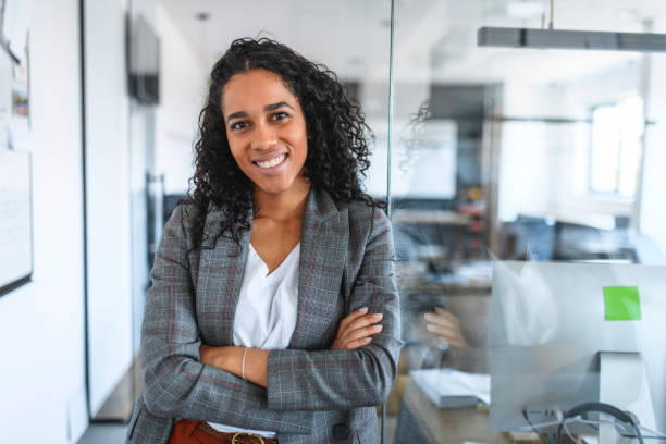 istock Smiling Young Hispanic Businesswoman in Modern Office 1162941432
