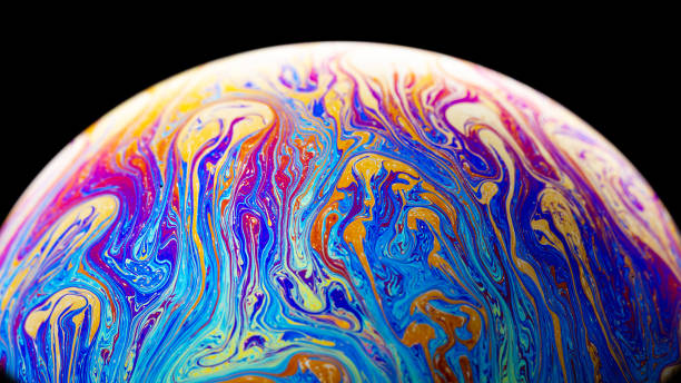 Abstract colorful planet on black background Virtual reality space with abstract multicolor psychedelic planet. Closeup Soap bubble  like an alien planet on black background eclipse photos stock pictures, royalty-free photos & images