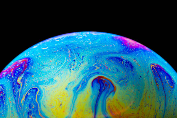 istock Abstract colorful planet on black background 1162942623