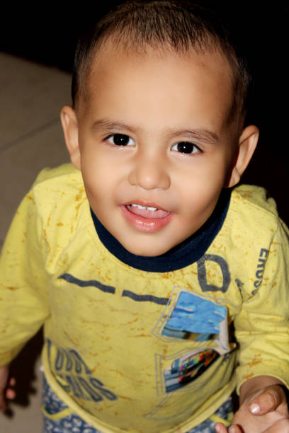 istock Cheerful child standing portrait at home 1162946390
